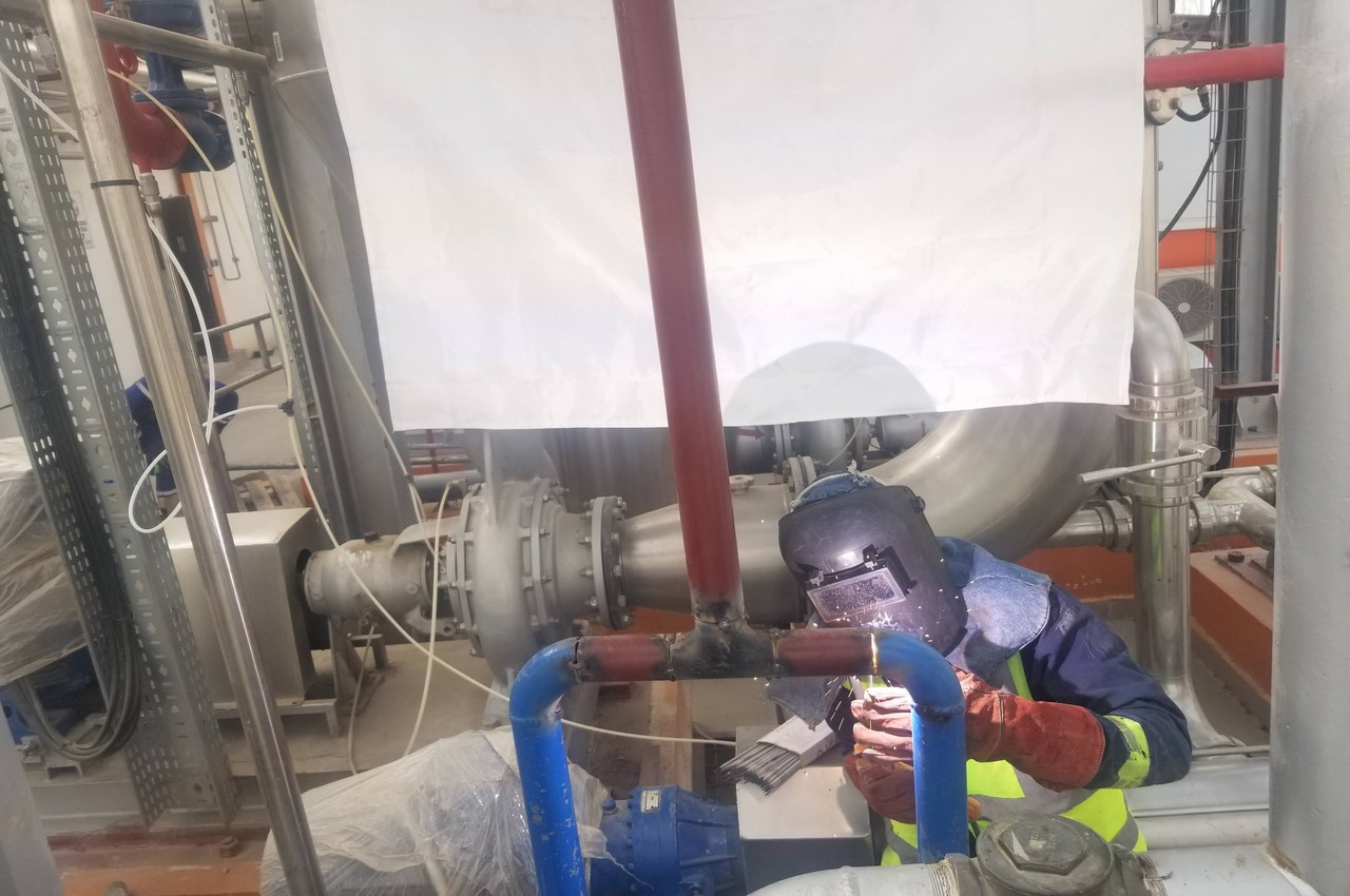 Fitting and welding of piping system for a pneumatic pump
