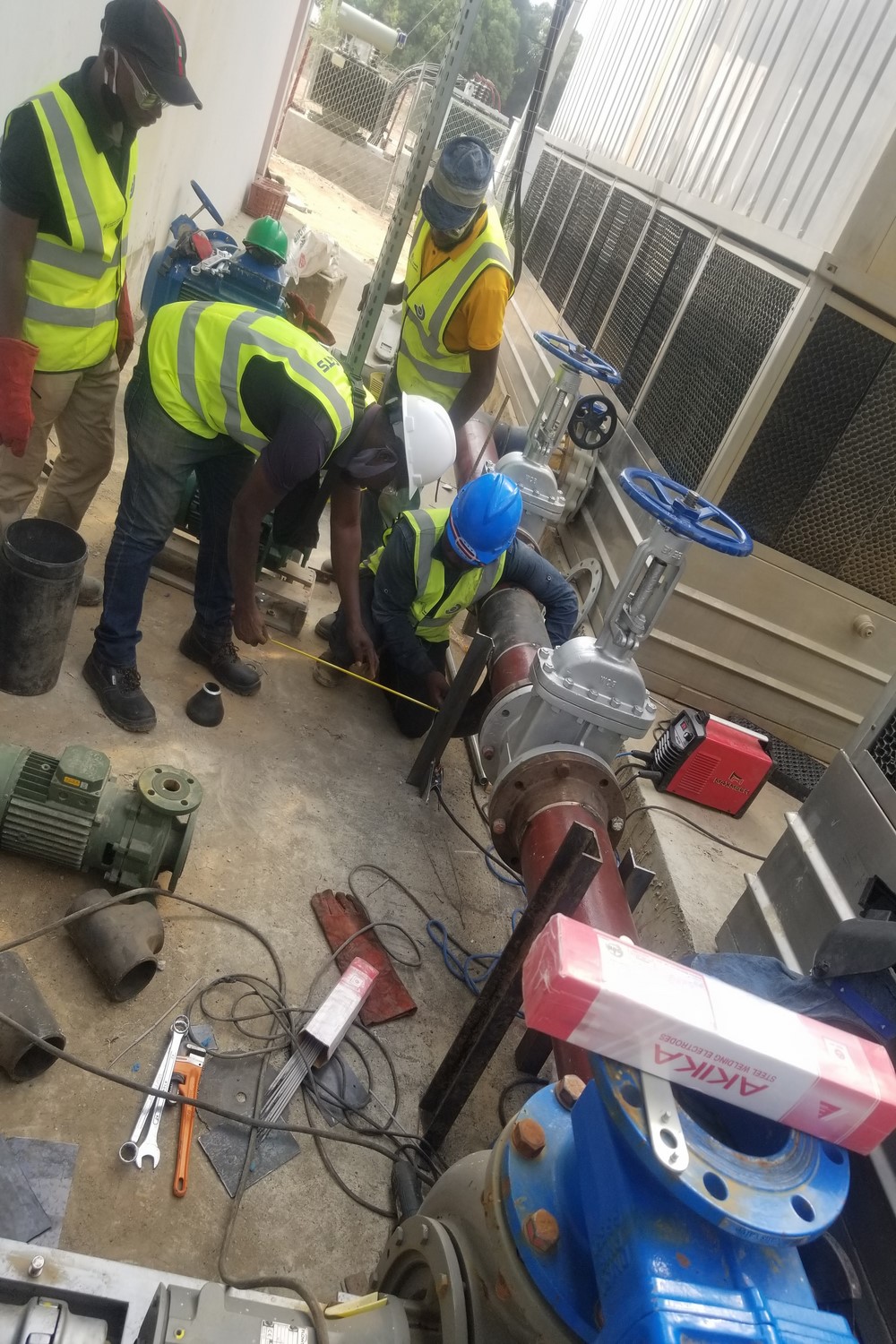 Mechanical fitting of pipes, fittings and valves for twin cooling tower pumps installation.